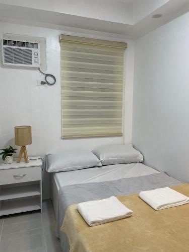 Postel nebo postele na pokoji v ubytování Bubees Place Cebu Staycation