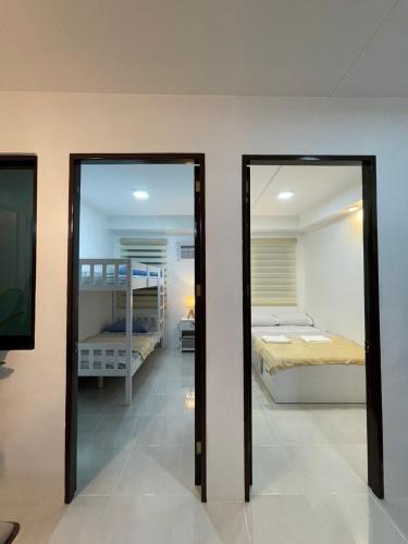 Postel nebo postele na pokoji v ubytování Bubees Place Cebu Staycation