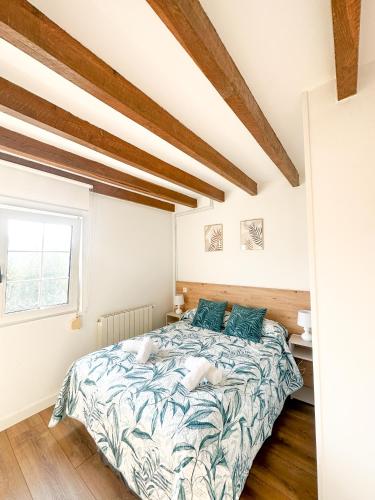 a bedroom with a bed and a window at casa rural cobreces in Cóbreces