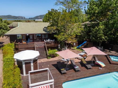 an aerial view of a backyard with a pool and a house at Knysna Lagoon - Summer Breeze in Knysna