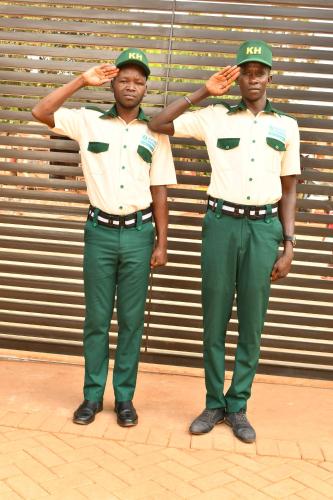two men in uniform standing next to each other at Kaloni Hotels in Seeta