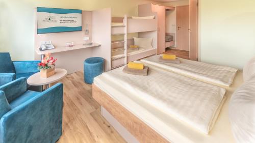 Ένα ή περισσότερα κρεβάτια σε δωμάτιο στο Hotel Thüringenschanze
