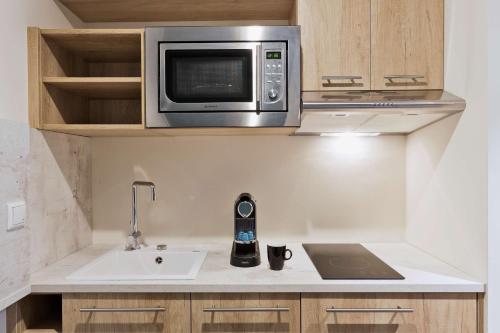 Η κουζίνα ή μικρή κουζίνα στο Stellaris Apartment Hotel