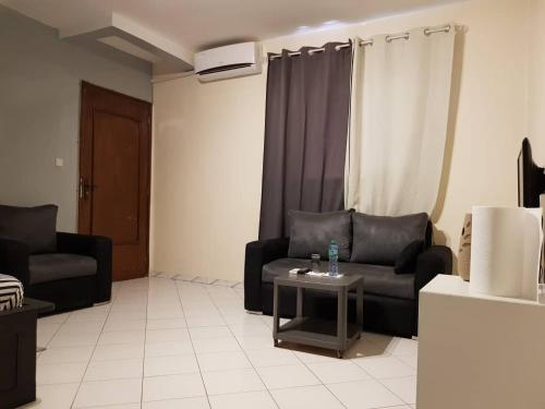 Zona d'estar a RESIDENCE ADSL Studio Sidy
