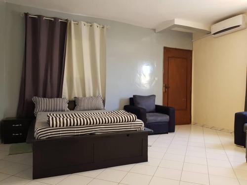 Zona d'estar a RESIDENCE ADSL Studio Sidy