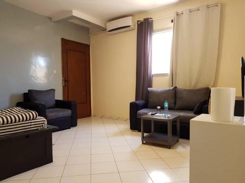 Zona d'estar a RESIDENCE ADSL Studio Sidy