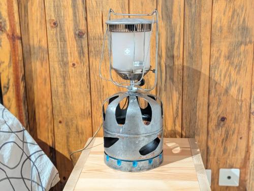a blender sitting on top of a wooden table at Gite en Cévennes avec piscine Intérieure chauffée in Ponteils-et-Brésis