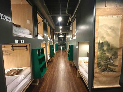 Postel nebo postele na pokoji v ubytování Yoroi Asakusa Hotel