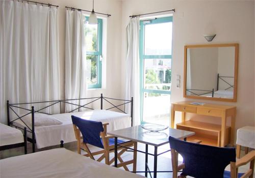 Posteľ alebo postele v izbe v ubytovaní Hotel Plakures