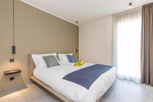 a bedroom with a large bed with bananas on it at ICON H Lugano - Luxury Suites & Apartments in Lugano