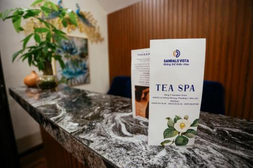 a table with a tea spa sign on it at Sandals Vista Hotel in Bao Loc