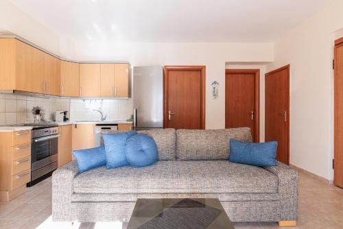 a living room with a couch and a kitchen at F & B Summer Collection - Kassandra - Siviri in Siviri