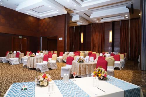 a banquet hall with tables and chairs in a room at Fortune Select JP Cosmos, Bengaluru - Member ITC Hotels' Group in Bengaluru