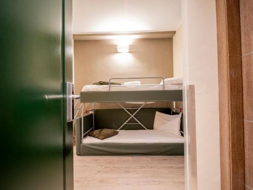 a small room with bunk beds in it at Best Quality Hotel Gran Mogol in Turin
