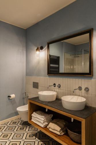 a bathroom with two sinks and a mirror at Villa Issima "The Bellagio Suite" - Menaggio by LoveComo in Menaggio