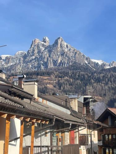 a view of a mountain from a city with a train station at SASS MAOR 2 bedrooms apartment 80 sm Fiera di Primiero TN in Fiera di Primiero