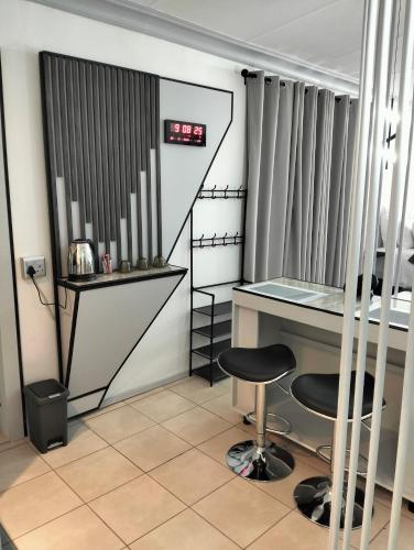 a room with a desk and a chair at 20 on Middle in Polokwane