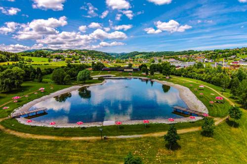 an aerial view of a large pond in a park at Landhaus GRETE in Stubenberg
