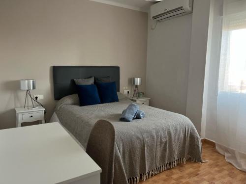 A bed or beds in a room at Vivienda con fines turísticos ALMA