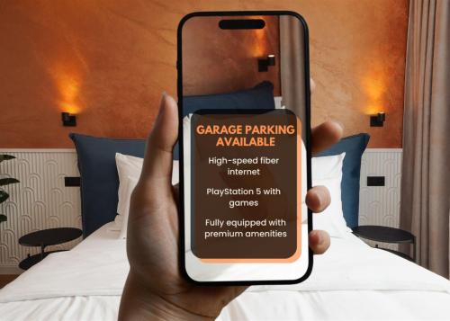 a hand holding up a cell phone with a warning sign on it at Luxury Sunny Home - Free Garage, Metro, Balcony, PS5, 2nd parking on request in Prague