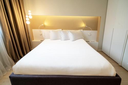 Ένα ή περισσότερα κρεβάτια σε δωμάτιο στο Lake Drive Rooms&Apartments