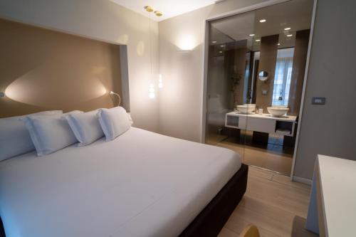 Ένα ή περισσότερα κρεβάτια σε δωμάτιο στο Lake Drive Rooms&Apartments