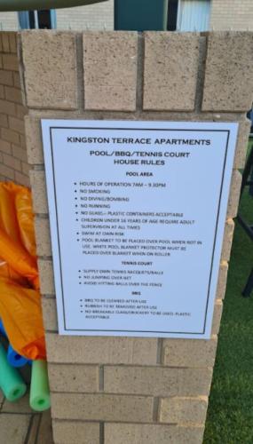 a sign on the side of a brick wall at Contemporary 2BR apartment near Kingston - Hosted by Canstay in Kingston 