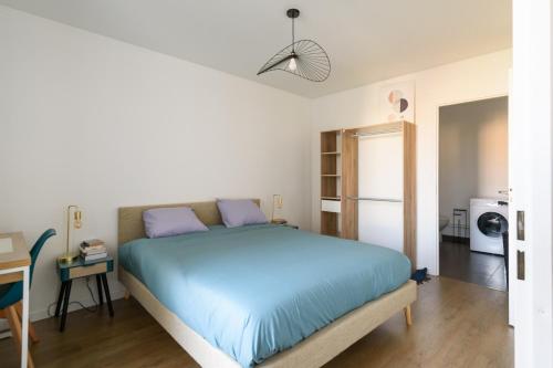 Postel nebo postele na pokoji v ubytování Les Marronniers - A 15min du Stade de France