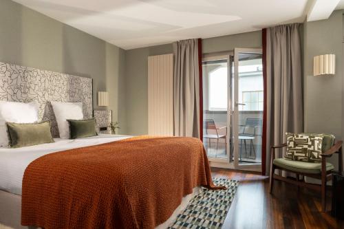 Postel nebo postele na pokoji v ubytování Hotel D - Basel - Fully Renovated 2025