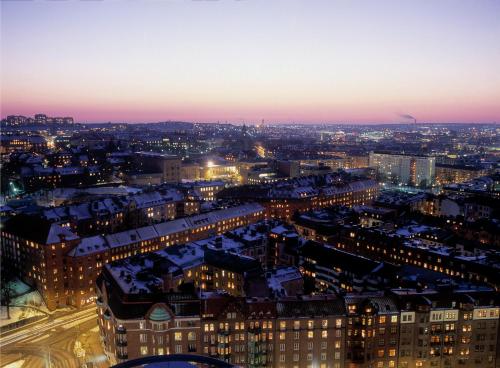 a view of a city at night at Gothia Towers & Upper House in Gothenburg