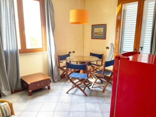 a dining room with a table and chairs at Zì Maria in Marina di Cecina