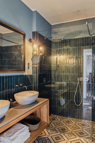 a bathroom with two sinks and a shower at Villa Issima "The Menaggio Suite" - Menaggio by LoveComo in Menaggio