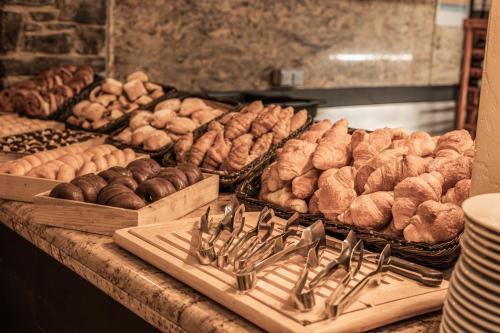 a counter with a bunch of different types of food at Yomo Patagonia in Arinsal