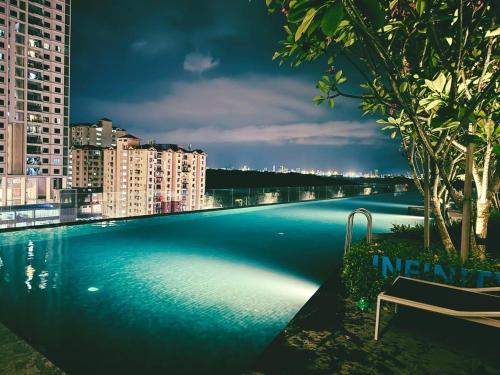 a large swimming pool on the roof of a building at Stunning Luxury Breathtaking Sea & City Views 3BR 12PAX in Jelutong