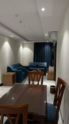 a living room with a couch and a table at HYATT RESiDENCE in Jeddah