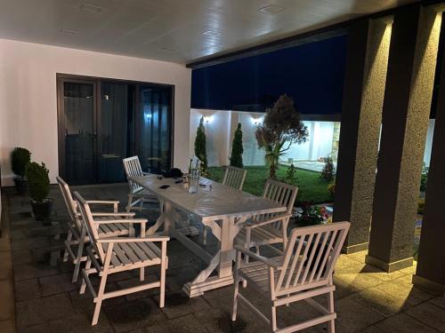 a wooden table and chairs on a patio at Villa Mayak in Baku