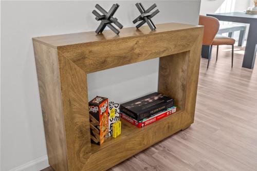 a wooden stand with books and zombies on top at 508 The Secret Sojourn in O'Fallon