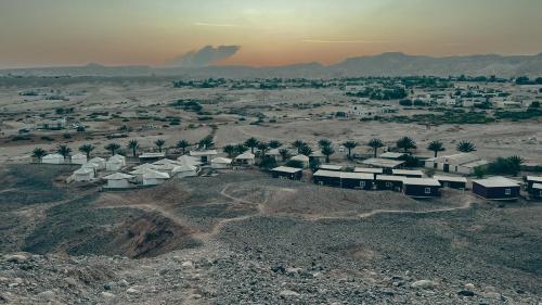 an aerial view of a village in the desert at Selina Tzukim in Zuqim