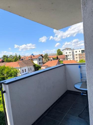 a balcony with a view of a city at Stan na dan Brčko Zaga Dusana Vasiljeva 7a in Brčko