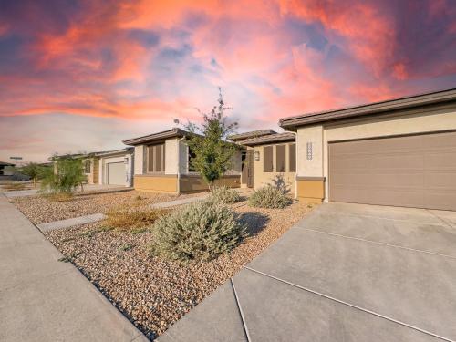a row of houses with a garage at Staman Queen Creek in Queen Creek