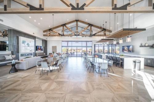 a large room with tables and chairs in a building at Staman Queen Creek in Queen Creek
