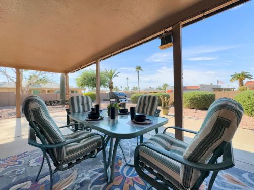 a table and four chairs on a patio at Truro Sun Lakes in Sun Lakes