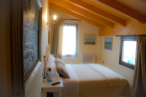 Postel nebo postele na pokoji v ubytování Art Gallery B&B Foresteria