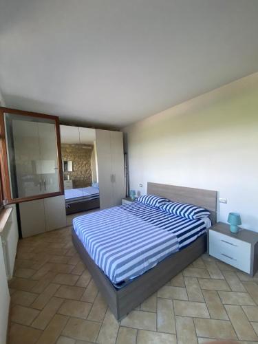 Ένα ή περισσότερα κρεβάτια σε δωμάτιο στο Apartment in the heart of Valpolicella