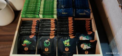 a drawer filled with black and green food items at Hotel Plzeňský Dvůr in Frýdek-Místek
