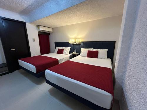 Postel nebo postele na pokoji v ubytování Choco's Hotel