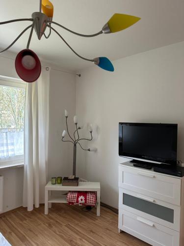 a living room with a flat screen tv on a wall at Barock Hengst Hof in Niederhaverbeck