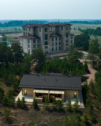 an overhead view of a house with a large building at Wyndham Residences Aqkol in Akkol'