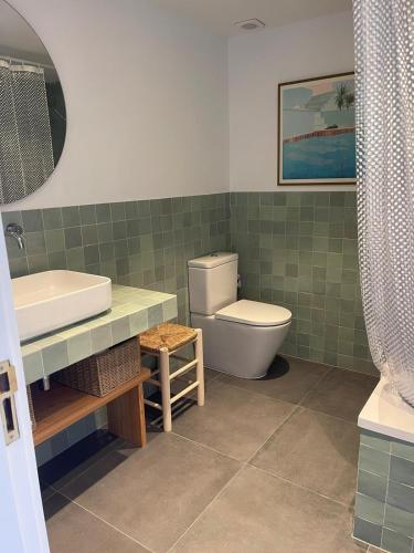 a bathroom with a sink and a toilet and a tub at Eden Mar Sant Antoni de Calonge in Sant Antoni de Calonge