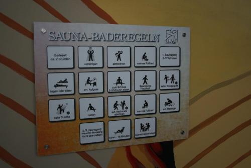 a sign on a wall with warnings about sanaaaberg at JUFA Hotel im Brückenkopfpark - Jülich in Jülich
